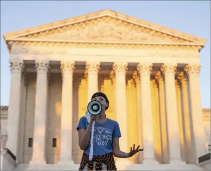  ?? DreW anGerer / Getty imaGes ?? an activist speaks outside the supreme court, protesting a new texas abortion law that prohibits the procedure around six weeks into a pregnancy. the supreme court declined to block the law.