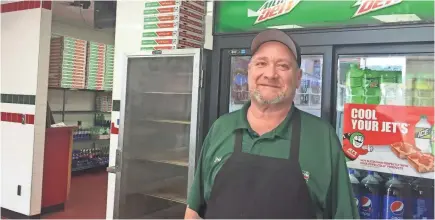  ?? USA TODAY NETWORK ?? Jeff Hueter of Jet’s Pizza in the Detroit metro area says schools are good business for deliveries.