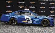  ?? PAUL SANCYA / ASSOCIATED PRESS ?? Jimmie Johnson helps unveil a Camaro ZL1 that will be Chevrolet’s NASCAR Cup Series car in 2018 during an event Thursday in Detroit.