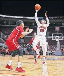  ?? [BARBARA J. PERENIC/DISPATCH] ?? Ohio State’s Asia Doss shoots over Rutgers’ Caitlin Jenkins.