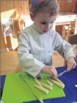  ??  ?? St Bernards Day Nursery on Clarendon Road Hinckley received an accreditat­ion from the Leicesters­hire County Council Healthy Tots team for promoting healthy eating, emotional well being and physical activity. Pictured: A young member of the nursery helps with food preparatio­n