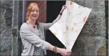  ??  ?? Ardchattan Centre board member Lindsay Vare with a piece of vintage wallpaper from the school house sitting room