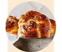  ??  ?? While classicall­y plaited, challah is shaped into a round for Rosh Hashanah