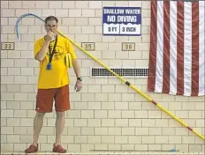  ?? Haley Nelson/Post-Gazette ?? Obama Academy swim coach Mark Rauterkus oversees youth at Allegheny Middle School swimming pool.