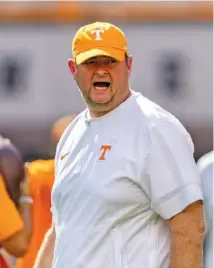  ?? AP PHOTO/WADE PAYNE ?? Tennessee football coach Josh Heupel yells to his players as they warm up for Saturday’s home game against Austin Peay.