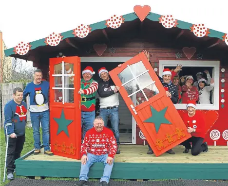  ??  ?? LOTTERY winners have created a giant gingerbrea­d playhouse for children’s charity The Yard in Dundee.
The charity supports disabled children and young people by offering a safe space to enjoy indoor and outdoor play.
The 13 lottery winners worked for...