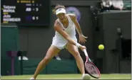  ?? KIRSTY WIGGLESWOR­TH - THE ASSOCIATED PRESS ?? Germany’s Tatjana Maria plays a return to Jule Niemeier in a women’s singles quarterfin­al match at Wimbledon on Tuesday.