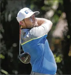  ?? GERRY BROOME / ASSOCIATED PRESS ?? Tyrrell Hatton hits his tee shot on the second hole Saturday at the RBC Heritage in Hilton Head Island, S.C., where 15 players are within two shots of the lead heading into today’s final round.