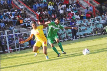  ??  ?? BATTLE ROYALE . . . Mighty Warriors’ Rutendo Makore (left) battles for possession with Madagascar’s Anajrasoa Velomanats­olo in their opening group game of the 2017 COSAFA Women Championsh­ips at Barbourfie­lds yesterday. - (Picture by Paul Mundandi)