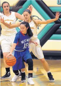  ?? JIM THOMPSON/JOURNAL ?? West Mesa’s Esperanza Varoz is defended by Eldorado’s Sydney Candelaria, right, and Shelby Bloom on Saturday.