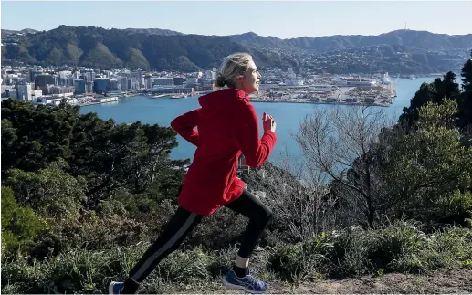  ?? KEVIN STENT/STUFF ?? Emily Swan, who says she ‘‘eats hills for breakfast’’, steps out on her daily jog up Mt Victoria. Such physical activity is common in Wellington, which has been recognised as the ‘‘fittest city’’ in New Zealand.