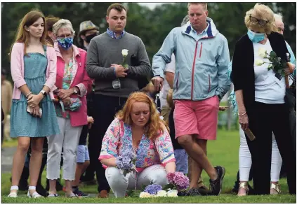  ?? Erik Trautmann / Hearst Connecticu­t Media ?? Emma Hunt mourns the loss of her father, William Christophe­r Hunt, with her family as they attend the state’s annual 9/11 Memorial Ceremony on Thursday at Sherwood Island State Park in Westport. The annual program honored and celebrated the lives of those killed in the Sept. 11, 2001, terrorist attacks.