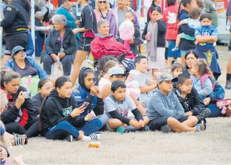  ??  ?? Crowds settle in for one of many musical performanc­es on Waitangi Day at Muau¯ poko Park.