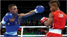  ??  ?? CLOSE CALL: Yafai [left] deals with the Cuban’s style well at the 2016 Olympic Games