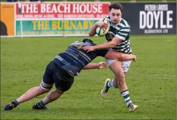  ?? ?? Matt O’Brien of Greystones is tackled by Navan’s Eoghan Noonan.