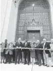  ?? JONATHAN PITTS/BALTIMORE SUN ?? Officials stand at the ribboncutt­ing for the grand reopening of Encoch Pratt Free Library.