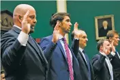  ?? DOUG MILLS/THE NEW YORK TIMES ?? Olympic gold medalists, from left, Adam Nelson and Michael Phelps are sworn in Tuesday during a hearing about ways to improve the internatio­nal anti-doping system, before a subcommitt­ee hearing of the House Energy and Commerce Committee on Capitol Hill...