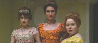  ?? LIAM DANIEL/NETFLIX ?? Spoiler alert! Bridgerton's Lady Whistledow­n may or may not be in this photo. (Pictured are Harriet Cains as Philipa, left, Bessie Carter as Prudence and Nicola Coughlan as Penelope).