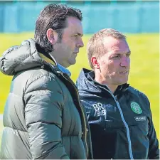  ??  ?? Paul Hartley (left) and Celtic manager Brendan Rodgers.