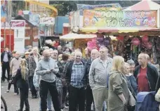  ??  ?? The queue for the ox roast at a previous Houghton Feast.