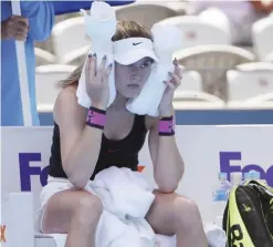  ??  ?? SYDNEY: Eugenie Bouchard of Canada tries to keep cool during a break while playing China’s Shuai Zhang during their women’s singles match at the Sydney Internatio­nal tennis tournament in Sydney, Australia, yesterday. — AP