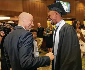  ?? Ralph Barrera / Austin American-Statesman ?? The UT athletic department held a reception for its 2017 graduates. Shaka Smart, left, didn’t coach T.J. Ford, right, at Texas, but the connection is strong.