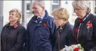  ?? ?? Right: Joan Anderson (daughter), Sam Blair (son-in-law), Ruth Blair (daughter) and Margaret Veitch (daughter) lay a wreath for William and Agnes Mullan, who were killed by the bomb.