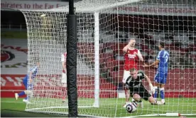  ??  ?? Bernd Leno looks round in despair after pushing Richarliso­n’s cross through his legs for Everton’s goal. Photograph: James Williamson - AMA/Getty Images