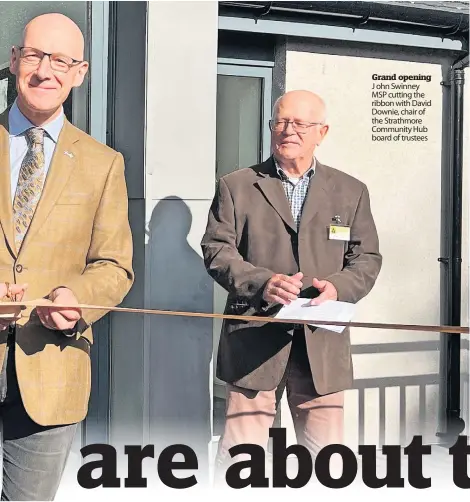  ?? ?? Grand opening J ohn Swinney MSP cutting the ribbon with David Downie, chair of the Strathmore Community Hub board of trustees