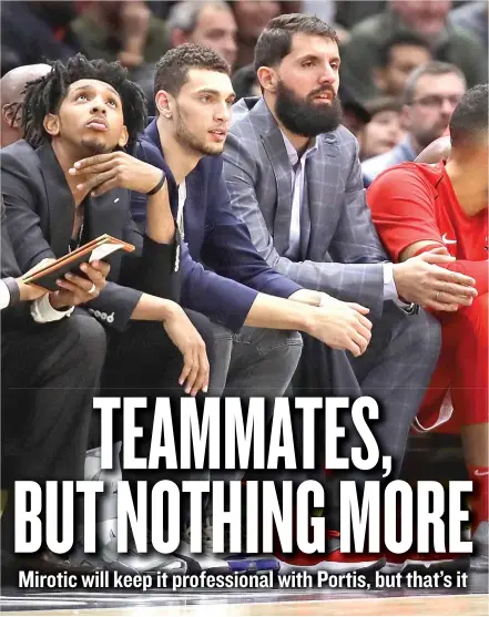  ?? | GETTY IMAGES ?? Injured Nikola Mirotic ( third from left) was on the Bulls’ bench for the first time this season Tuesday against the Suns.