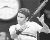  ?? SAEED KHAN/GETTY-AFP ?? Roger Federer returns against Hyeon Chung during their Australian Open semifinal. Federer next faces Marin Cilic.