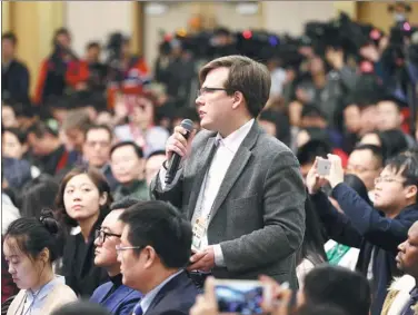  ?? WANG ZHUANGFEI / CHINA DAILY ?? A reporter from Russian state news agency TASS raises a question on China’s foreign policy and foreign relations at a news conference for the fifth session of the 12th National People’s Congress in Beijing on Wednesday.
