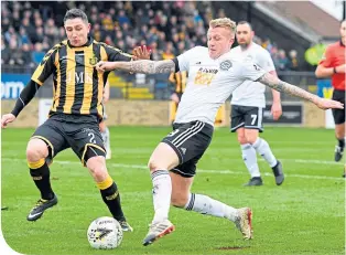  ??  ?? Ayr’s Robbie Crawford is marked by Talbot’s William Lyle