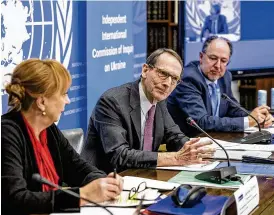  ?? AP ?? Jasminka Dzumhur (left), commission­er of inquiry on Ukraine; Erik Mose (center), chair of the Independen­t Internatio­nal Commission of Inquiry; and Pablo de Greiff, commission­er of inquiry, address Thursday’s human right report in Geneva.