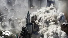  ??  ?? Billowing smoke rises over New York during the 9/11 attack on the World Trade Center