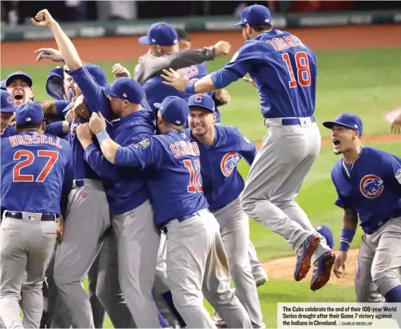  ??  ?? The Cubs celebrate the end of their 108- year World Series drought after their Game 7 victory against the Indians in Cleveland.
| CHARLIE RIEDEL/ AP