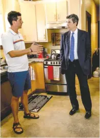  ??  ?? Calvin Ball, vice president of Tower Constructi­on, left, talks Wednesday with Mayor Andy Berke about a home on Chamberlai­n Avenue built partly with a city grant.