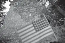  ?? [AP PHOTO/JEAN-FRANCOIS BADIAS] ?? A plaque in homage to U.S soldier Yohei Sagami, of Hawai, who died in October 1944 in the village in Laval-sur-Vologne, eastern France, is picture Friday.