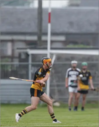  ??  ?? Fermoy’s David Lardner fires over a free against Ballyhea during Tuesday night’s Division 2 League game in Fermoy Photo by Eric Barry