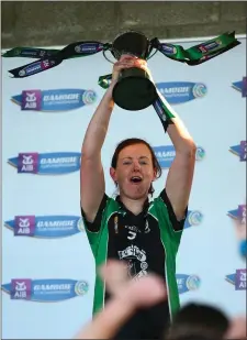  ?? Photo by Tom O’Hanlon / Inpho ?? Clanmauric­e’s Liz Houlihan lifts the cup after victory in Nenagh last Sunday afternoon