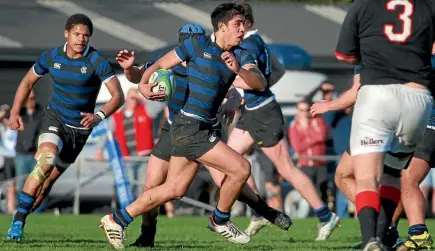  ?? PHOTO: FAIRFAX NZ ?? Anton Lienert-Brown spots a gap while representi­ng the Christchur­ch Boys’ High School 1st XV against St Bede’s in 2012.
