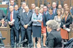  ??  ?? Friendly faces: female government aides stand near the entrance to the chamber