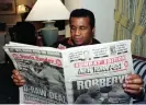  ?? ?? Lennox Lewis’s trainer in 1999, Emanuel Steward, reads the New York Post the day after his boxer’s controvers­ial draw with Evander Holyfield. Photograph: Reuters
