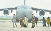  ?? PTI ?? People who were stranded in Afghanista­n arrive by a special repatriati­on flight of IAF in Ghaziabad on Sunday.
