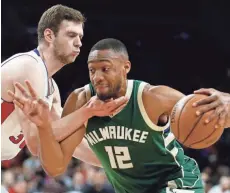  ?? GETTY IMAGES ?? The Milwaukee Bucks’ Jabari Parker drives around Jon Leuer of the Detroit Pistons in Wednesday night’s game at The Palace.