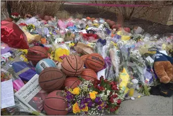  ?? PETE BANNAN – MEDIANEWS GROUP ?? A memorial to Kobe Bryant has grown each day at the entrance to the gym at Lower Merion High School. The gym bears Bryant’s name.