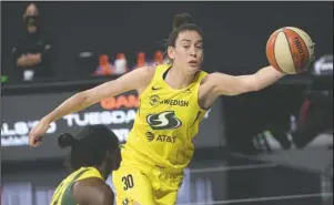  ?? The Associated Press ?? NICE SAVE: Seattle Storm forward Breanna Stewart (30) saves a ball from going out of bounds by tipping it to guard Jewell Loyd (24) Sunday during the first half of Game 2 of the WNBA Finals against the Las Vegas Aces in Bradenton, Fla.