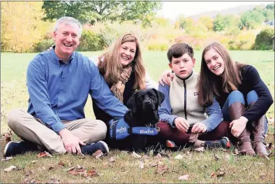 ?? Michelle Brier / Contribute­d photo ?? The Collins family, of Ridgefield, were matched with BluePath service dog Chelsea in 2019. Chelsea is specially trained to provide safety, companions­hip and opportunit­ies for independen­ce for children with autism.
