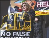  ?? EDDIE MOORE/AP ?? MARIEL NANASI, with New Energy Economy, speaks at a protest against an initiative by Gov. Michelle Lujan Grisham to develop a strategic new source of water, buying treated water that is the byproduct of oil and natural gas drilling, then treating it and selling it back to industry.