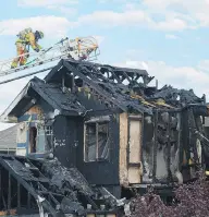  ?? SHAUGHN BUTTS / POSTMEDIA NEWS ?? A suspicious fire destroyed a home in the southwest Edmonton community of Ambleside on Tuesday.